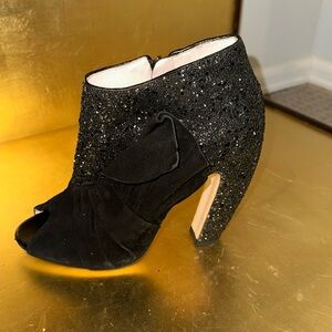 Black Suede embedded w/black beads side zipper peep toe.